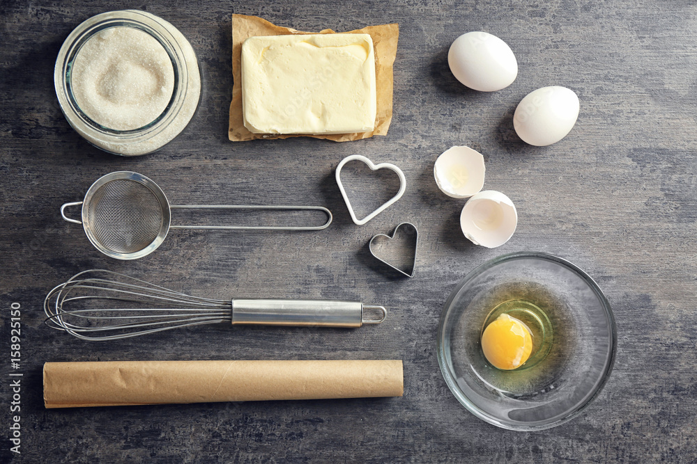 Ingredients for preparing butter cookies on kitchen table