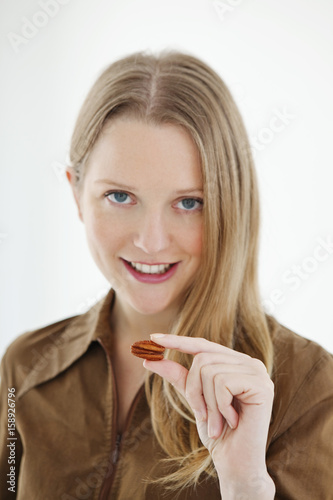 Woman eating dried fruit