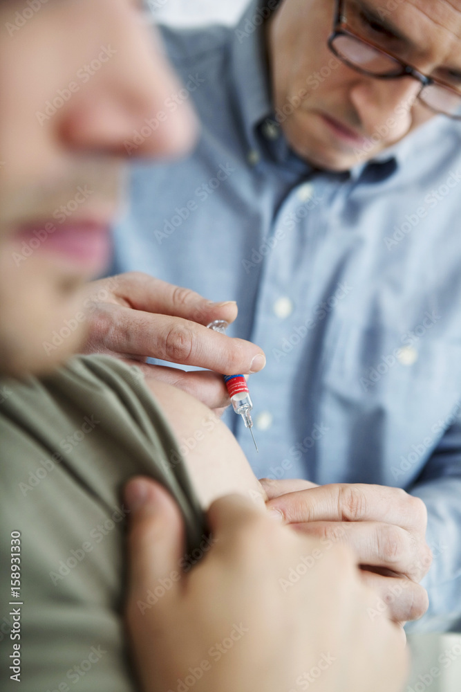 Vaccinating a man