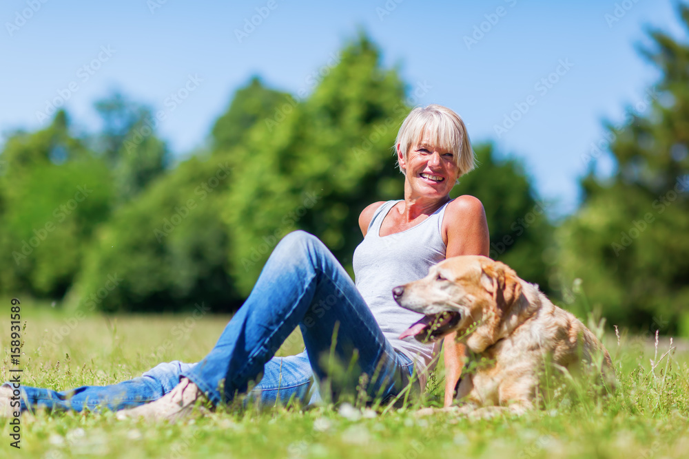 mature woman with a dog outdoor