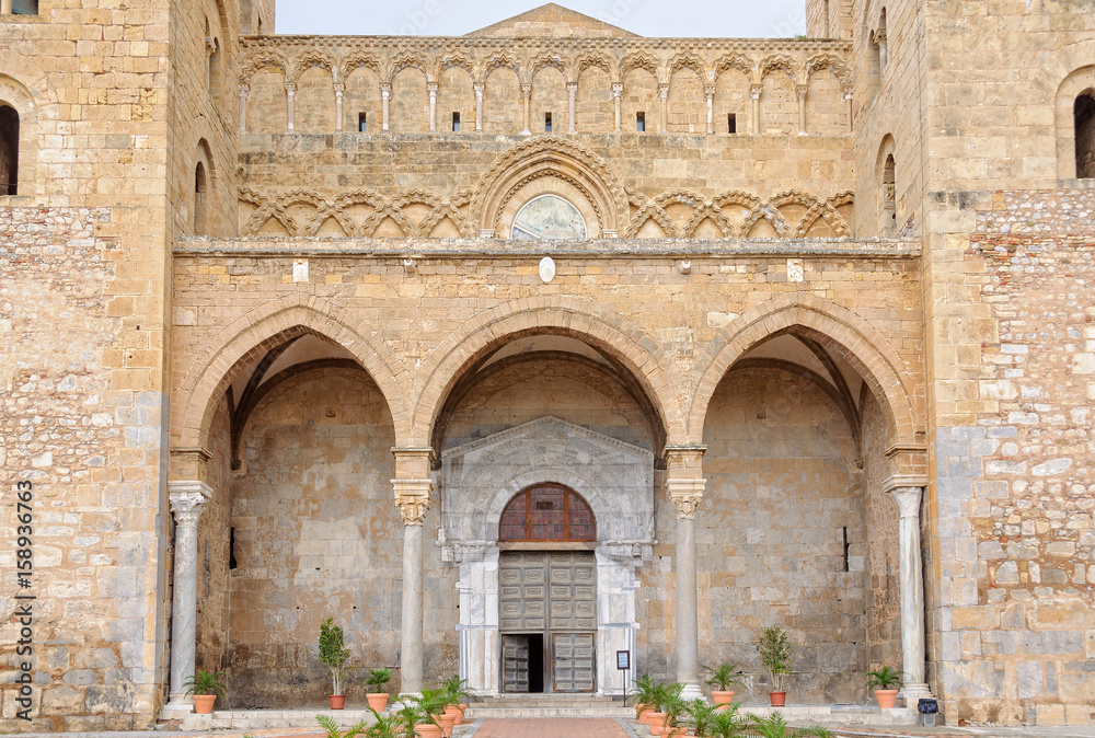 The 15th-century portico of the Cathedral-Basilica has three arches - Cefalu, Sicily, Italy