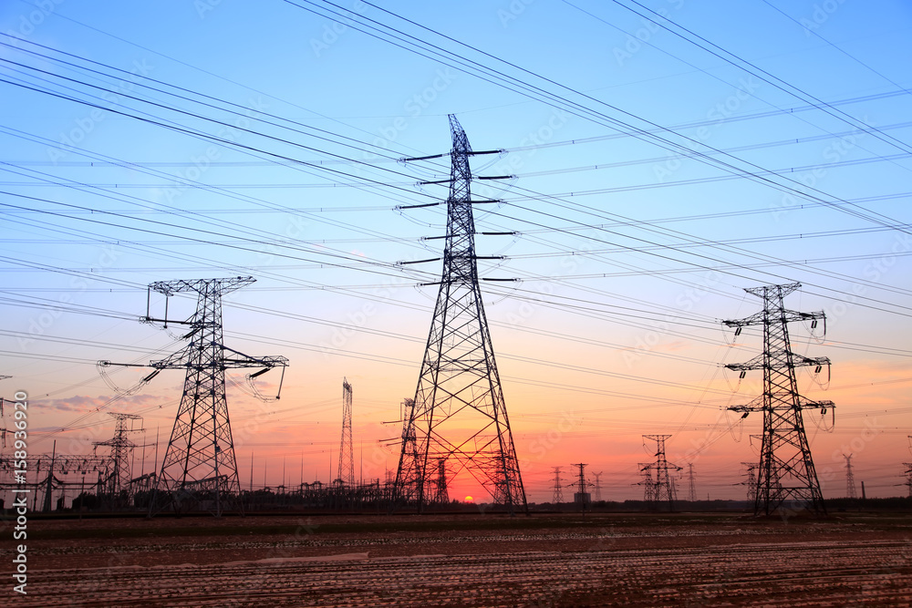 The silhouette of high voltage towers