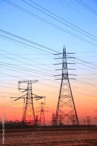The silhouette of high voltage towers