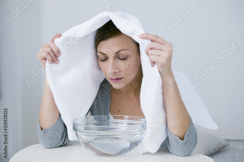 Woman doing inhalation
