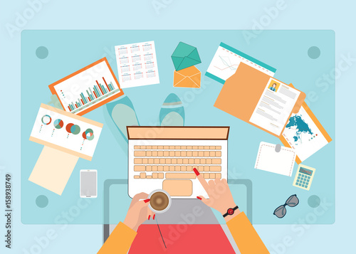 Top view of Busy business woman working hard on her desk .