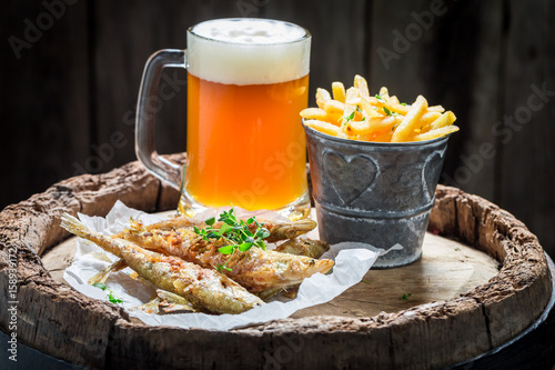 Homemade smelt fish with chips and cold beer