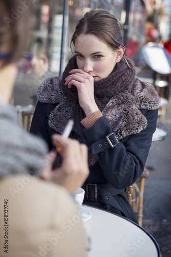Woman bothered by cigarette smoke
