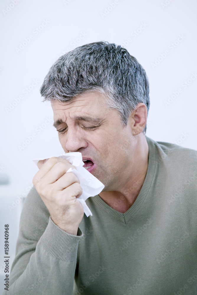 Man sneezing Man sneezing