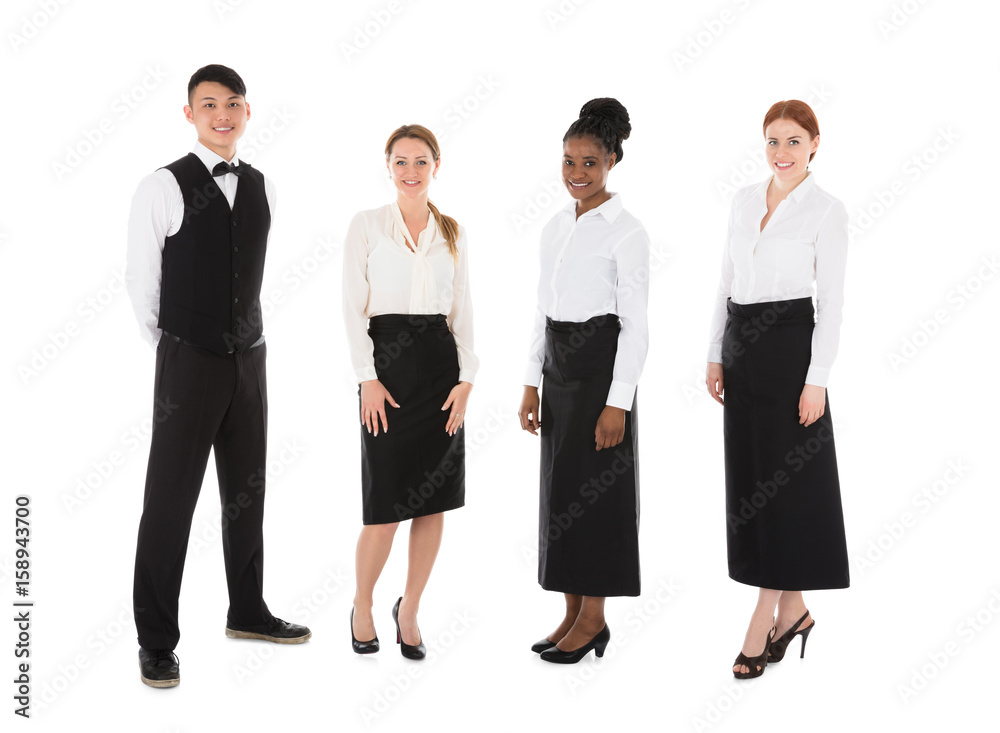 Portrait Of Happy Young Restaurant Staff