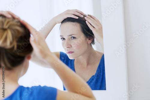 Woman looking in a mirror