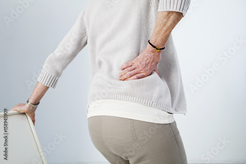 Lower back pain in elderly person
