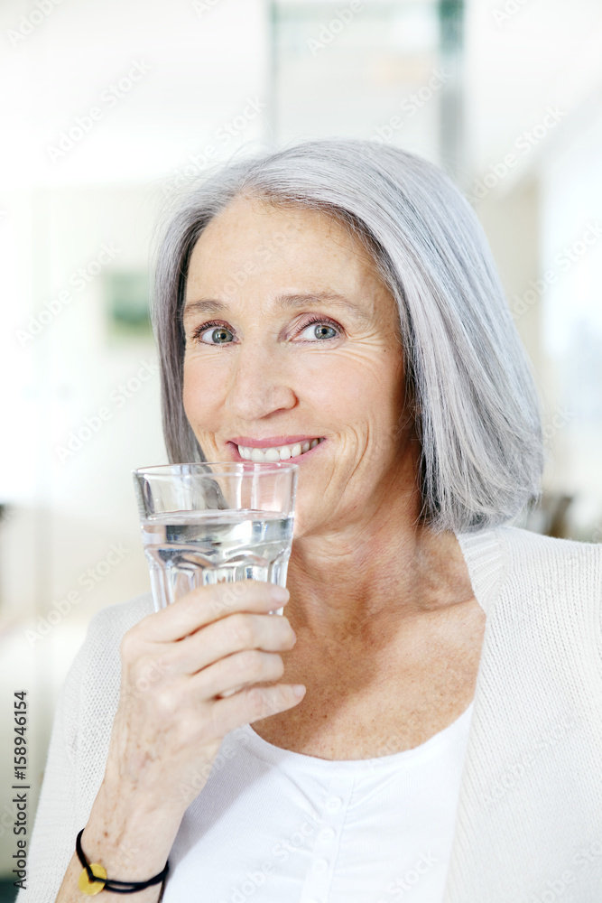 Elderly person with cold drink