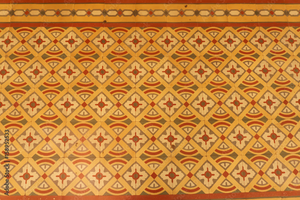 Colonial house architecture Vintage floor tiles with orange, green, red as a decorative design pattern