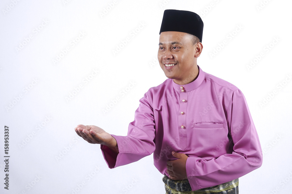 Man in traditional clothing, standing celebrate Eid Fitr. Man in traditional clothing, standing celebrate Eid Fitr.