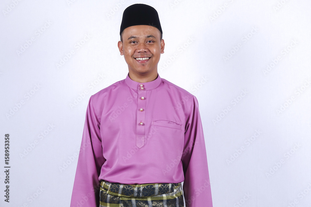 Man in traditional clothing, standing  celebrate Eid Fitr.