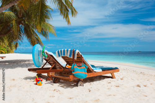 Fototapeta Naklejka Na Ścianę i Meble -  Two beach chairs on tropical vacation