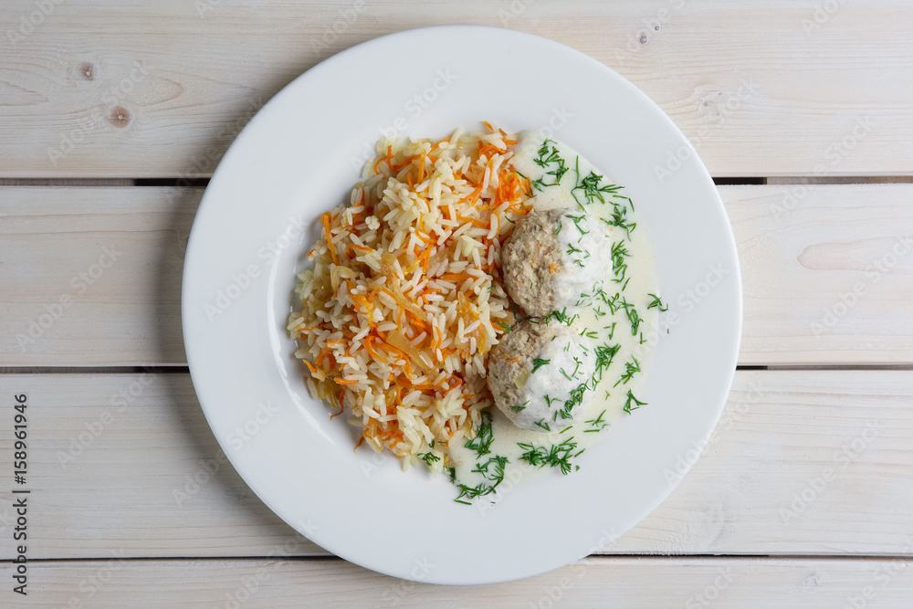 Top view of plate with meatballs with rice and carrot. Top view of plate with meatballs with rice and carrot.
