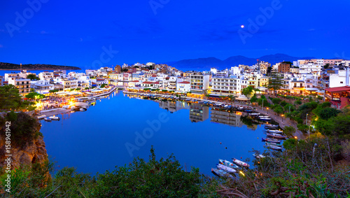 The lake Voulismeni in Agios Nikolaos, a picturesque coastal town with colorful buildings around the port in the eastern part of the island Crete, Greece