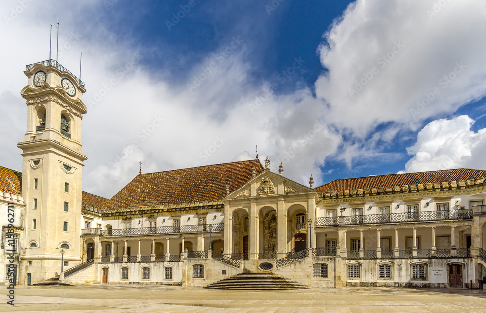 Courtyard with clock tower in complex University of Coimbra - Portugal