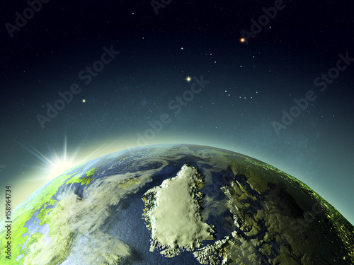 Fototapeta Naklejka Na Ścianę i Meble -  Sunset above Greenland from space