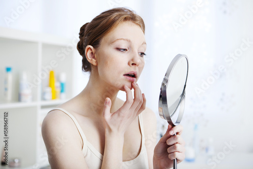 Woman with mirror photo