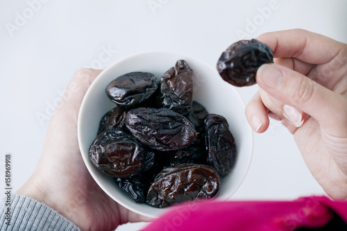 Woman eating prunes