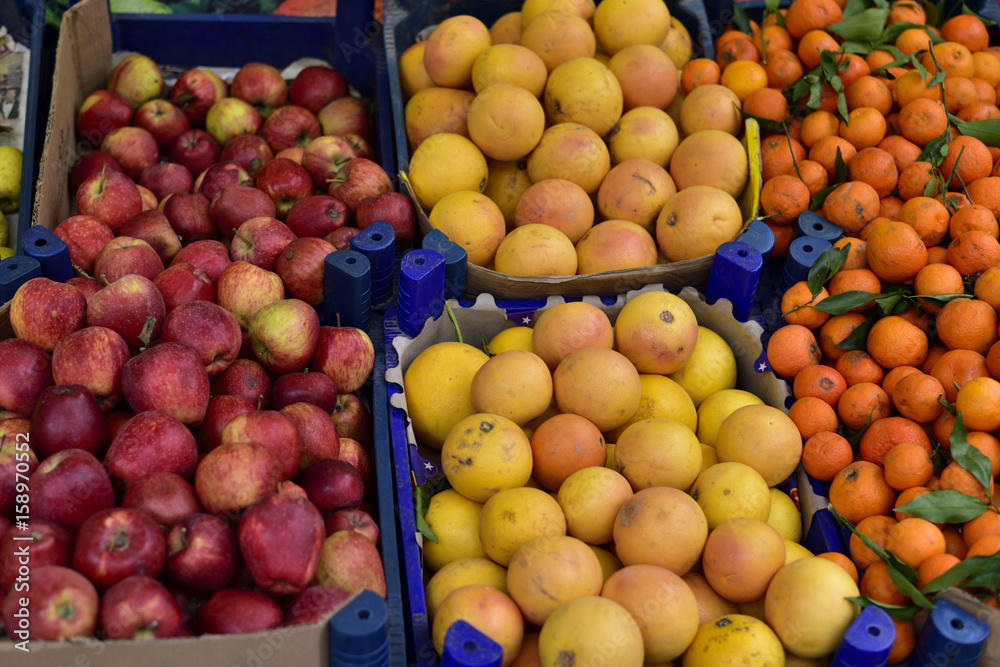 Organic apple, grapefruit and mandarin in a public bazaar