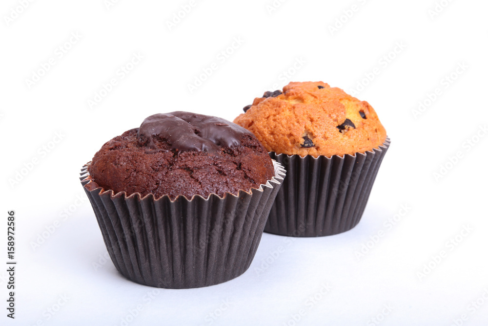 Fresh homemade muffins on white background. Top view. Fresh homemade muffins on white background. Top view.