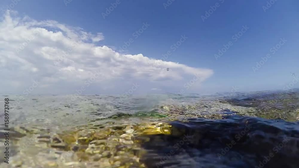 Sea waves on the shore with fragments of underwater shooting Sea waves on the shore with fragments of underwater shooting