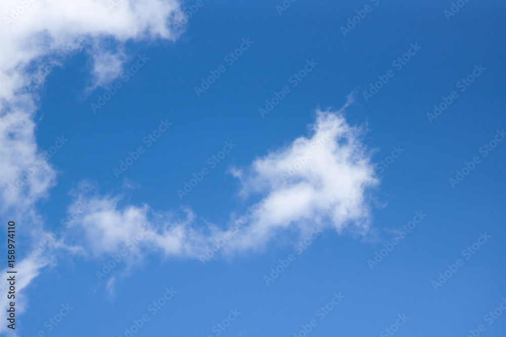 White clouds against a blue sky White clouds against a blue sky