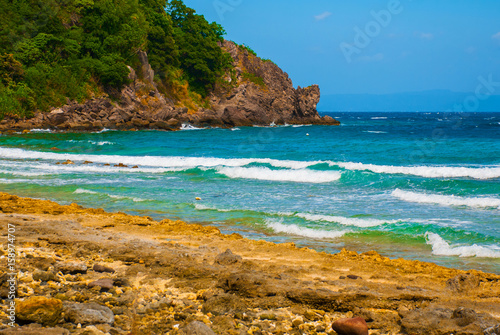 Beautiful sea. Apo, Philippines, view on island beach line. photo