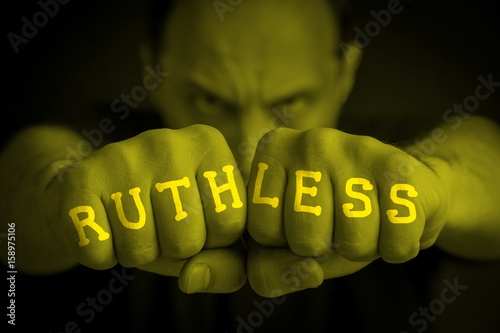 RUTHLESS written on an angry man fists