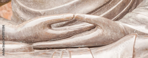 Detail of Buddha statue with Dhyana hand position, the gesture of meditation