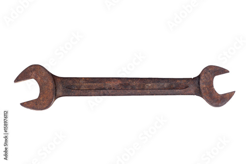 Old spanner on white background