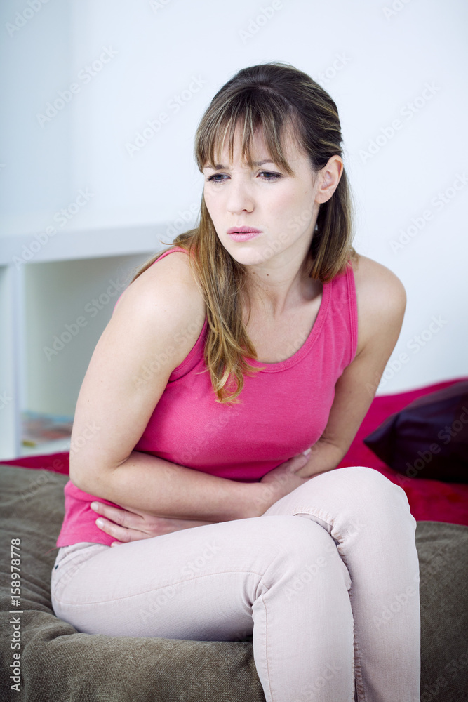 Woman suffering from abdominal pain