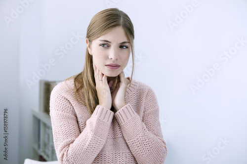 Woman with sore throat photo