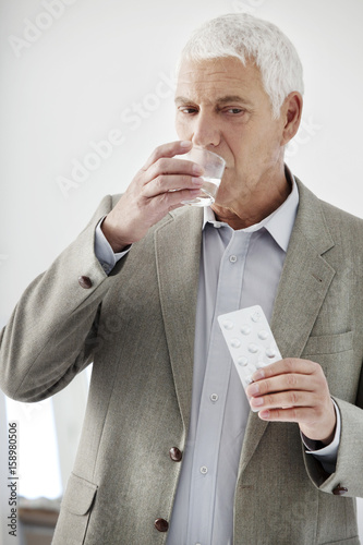 Elderly person taking medication © RFBSIP
