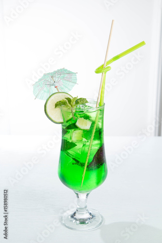 Lemonade tarhun or estragon with ice and lime on white background