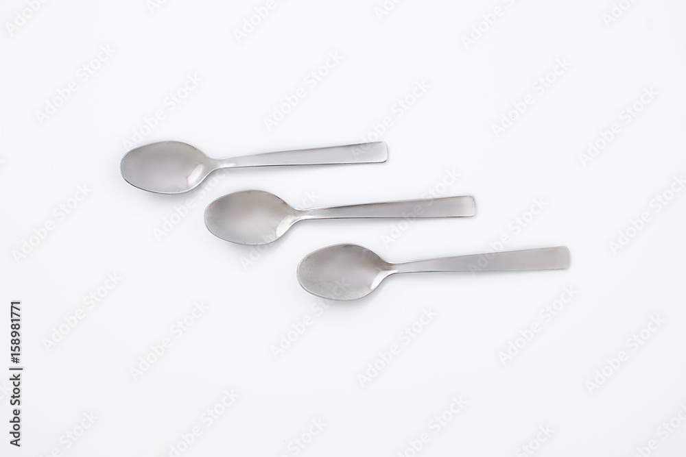 Silver three spoons on a white background Silver three spoons on a white background