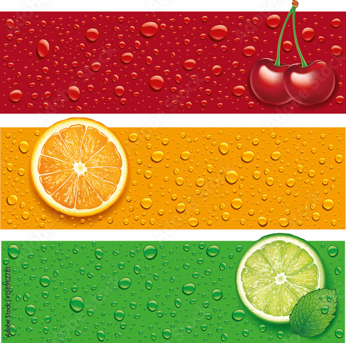 cherry, orange, lime, mint on background with many water drops