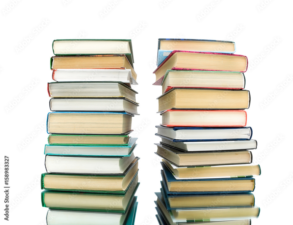 stack of books on a white background with reflection stack of books on a white background with reflection