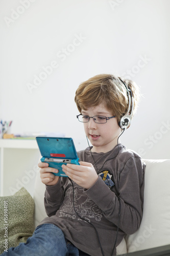 Child playing with video game