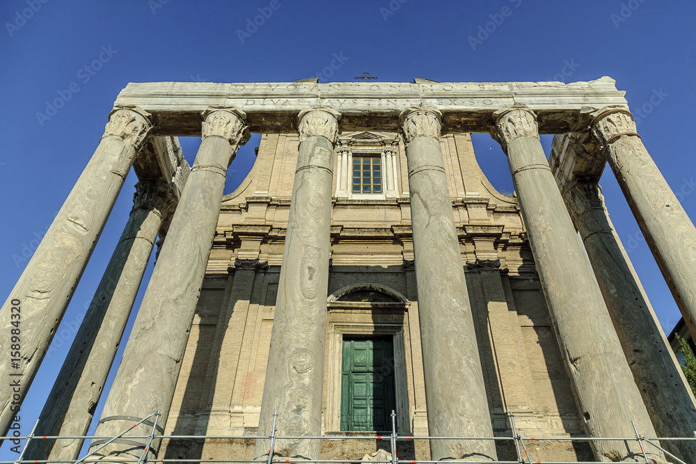 columns in the front of a church in the Roman imperial forum in Rome, Italy.