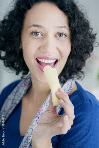 Woman eating cheese