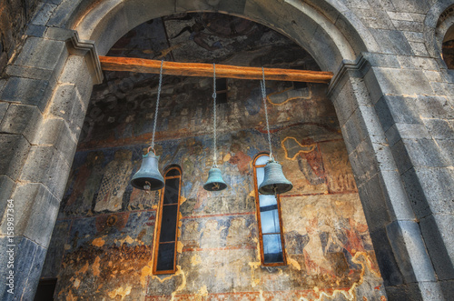 Church of Dormition in Vardzia cave ancient monastery in Samtskhe-Javakheti region, Georgia. Old bells hang from ceiling
