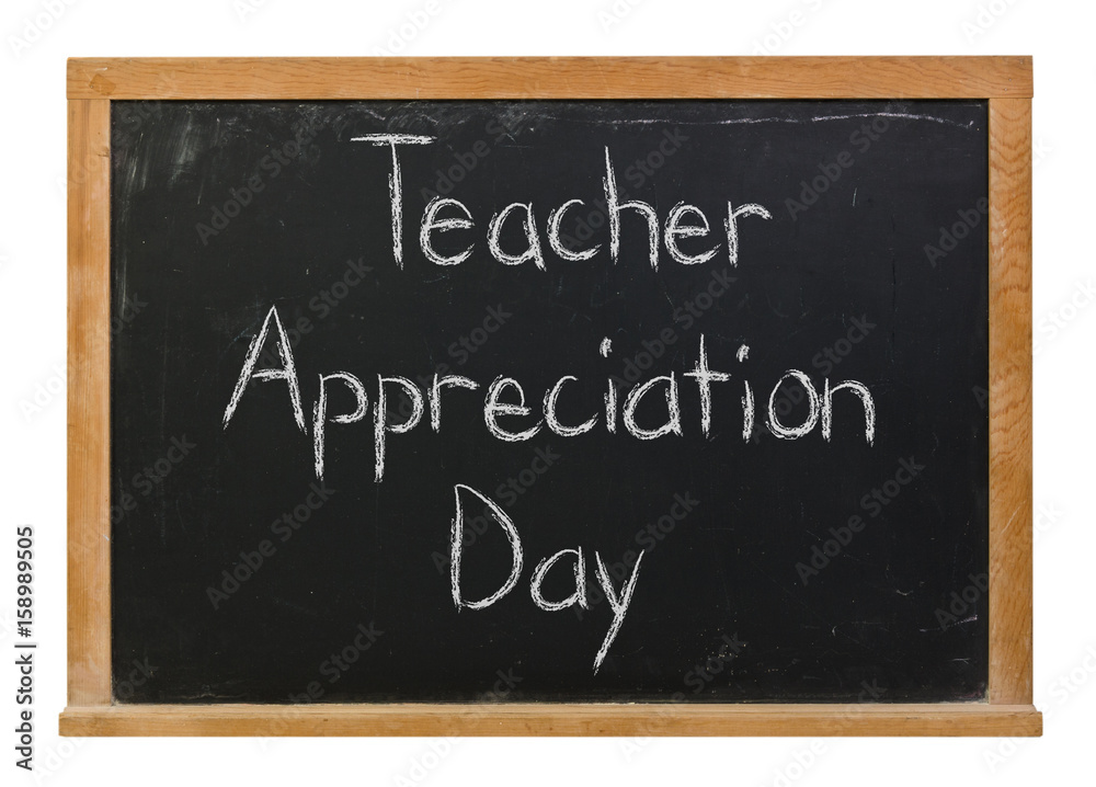 Teacher Appreciation Day written in white chalk on a black chalkboard isolated on white Teacher Appreciation Day written in white chalk on a black chalkboard isolated on white