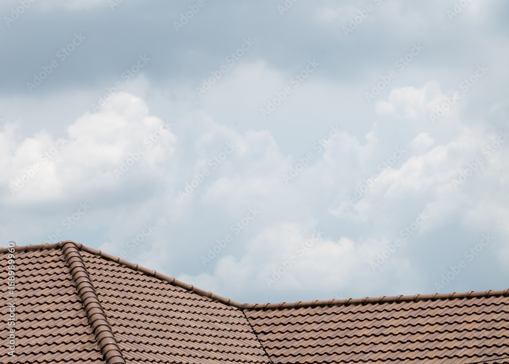 brown peaked roof. a roof top with red tiles. brown peaked roof. a roof top with red tiles.