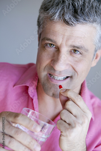 Man taking medicine