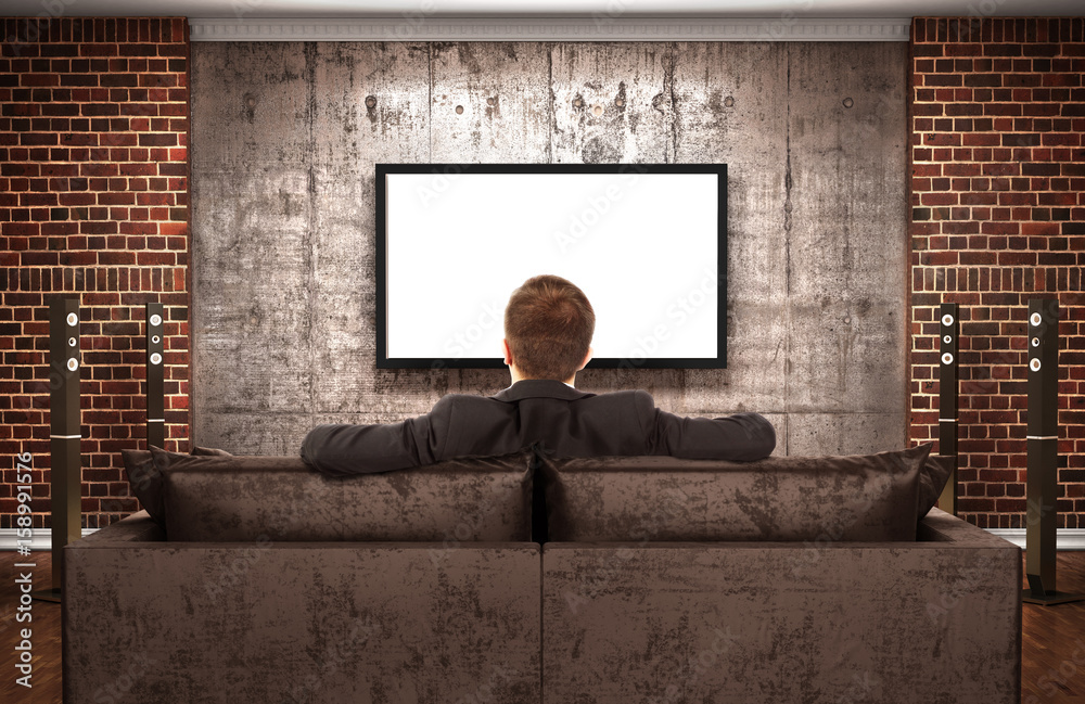 The concept of zombification. A man is watching TV in a dark room