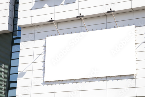 blank mockup outdoor advertising with copy space on the wall of the mall building